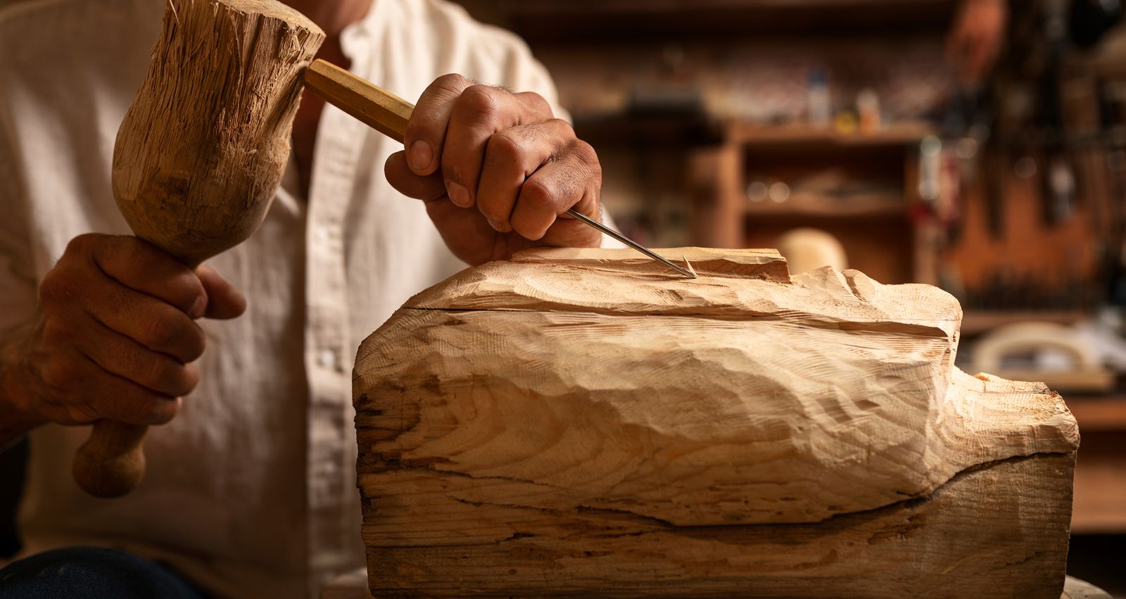 An artisan shaping a piece by hand
